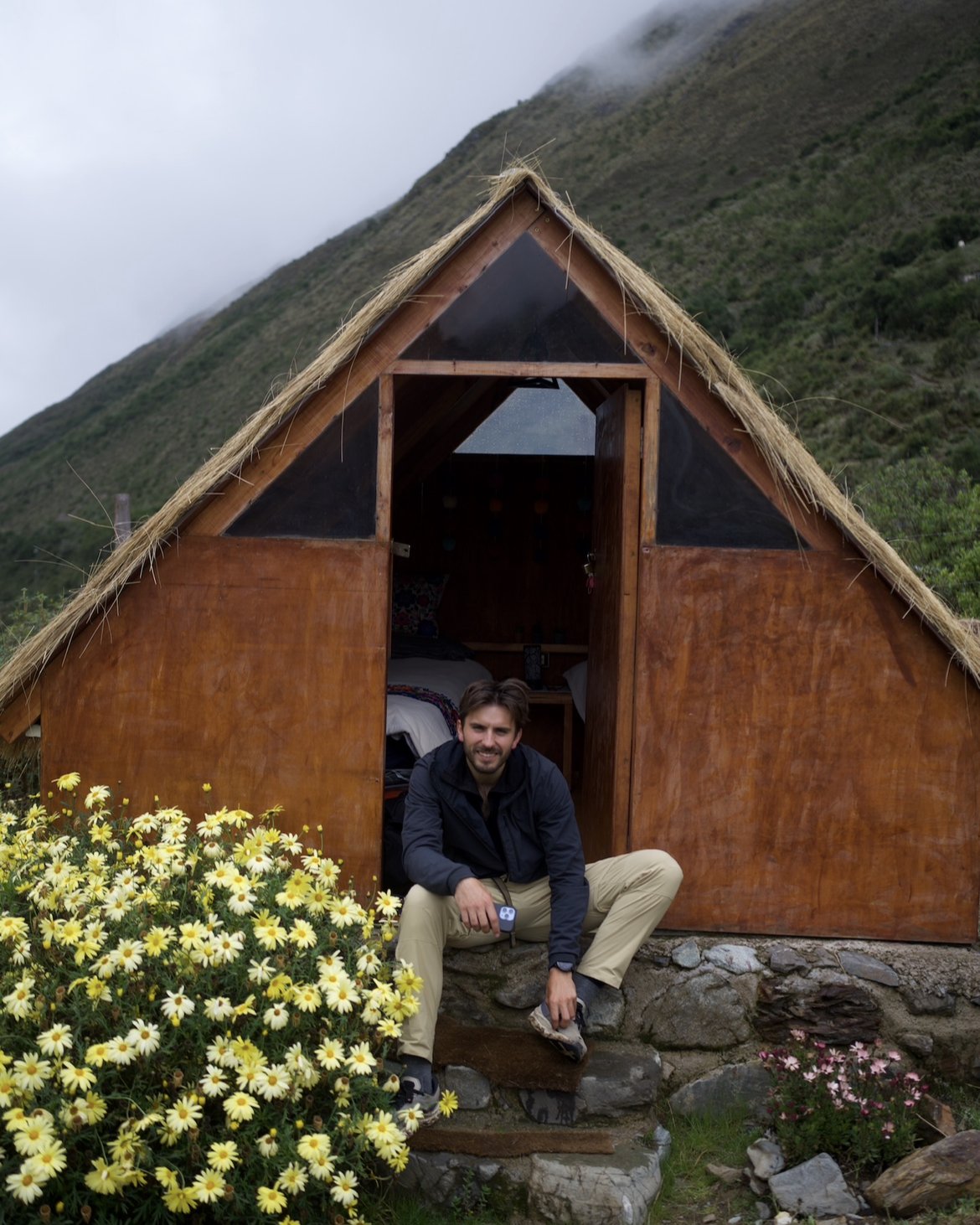 Eirik Simón Ortega Guttelvik outside a hut in the Andes